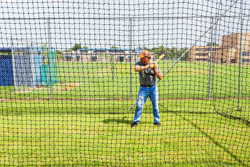 Batter and Baseball Batting Cage